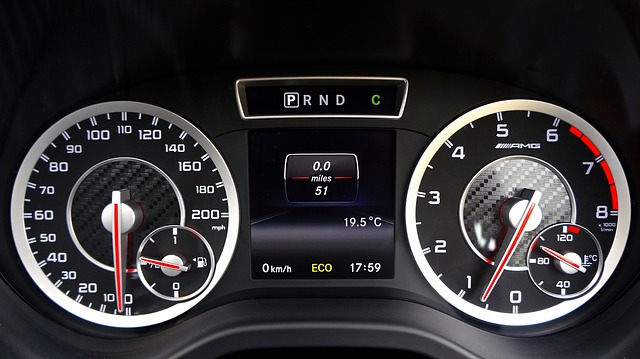 Dials on a modern car showing a speedometer, tachometer, and other information